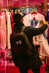 Man browsing for clothes and secondhand apparel