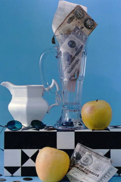 Leslie Gill, Composition with Apples, Pitcher and Confederate Money, NYC, 1953. Copyright Leslie Gill, Courtesy Howard Greenberg Gallery