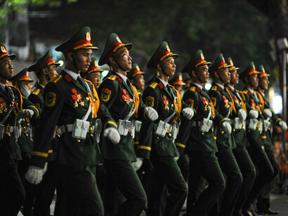 A military parade taking place at night in Hanoi, Vietnam