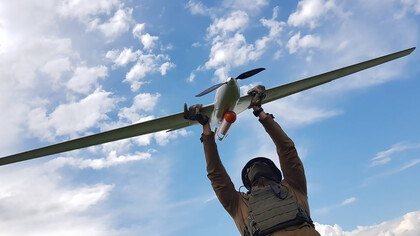 A Ukrainian soldier holds a Punisher drone used by Ukrainian forces