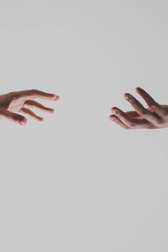 Two hands reaching out to connect