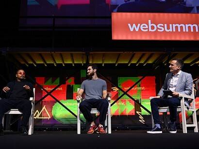 Speakers, from left: Patrice Evra, professional footballer and investor; Napper Tandy, CEO of One House; and Adam Leventhal, journalist and broadcaster for The Athletic and Sky Sports, on the SportsTrade Stage during day one of Web Summit