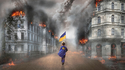 Boy holding Ukrainian flag walks through post-war ruins