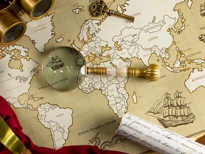 On the table, a captivating arrangement of pirate artifacts includes an old map, an ornate pipe, and a vintage magnifying glass, capturing the essence of maritime adventure