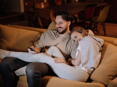 Couple enjoying a tv show together
