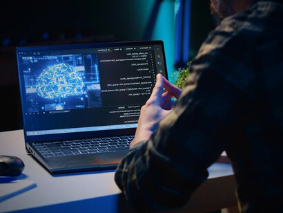 A tech-savvy IT specialist enhances AI capabilities from their apartment office using advanced programming techniques
