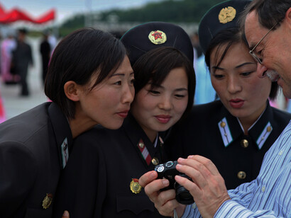 North Korea holds the title of the most militarized country in the world, with a staggering 1.1 million military personnel, making it the fourth largest army globally, and a notable number of women soldiers playing key roles in its defense forces