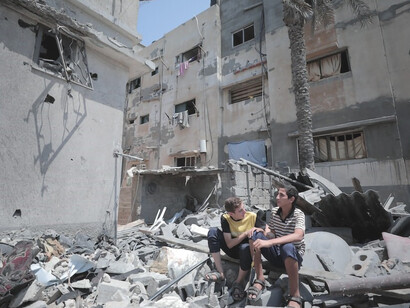 In the midst of Gaza's shattered buildings, individuals courageously endure the aftermath of the bomb blasts, Palestine