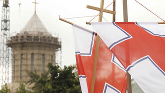 Standards of the Georgian Orthodox Church flying by the Cathedral of the Holy Mother of Iberia in Zugdidi, Georgia, during the 2020 Vlakernoba procession, Georgia