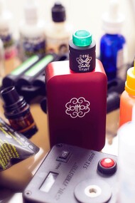 A collection of vape machines and liquids 