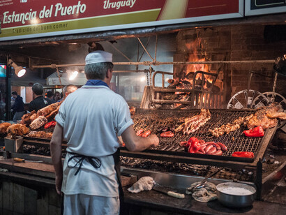 A South American chef cooking meat