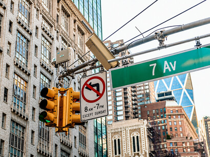 No-turn traffic sign above 7th Avenue in Midtown Manhattan, highlighting urban traffic control systems in the USA