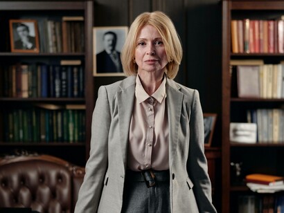 A politician in her office summoning the influence to combat those public opinions that are opposed to her policy