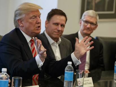 Tim Cook, right, and Peter Thiel, center with President-elect Donald Trump at a meeting with technology industry leaders