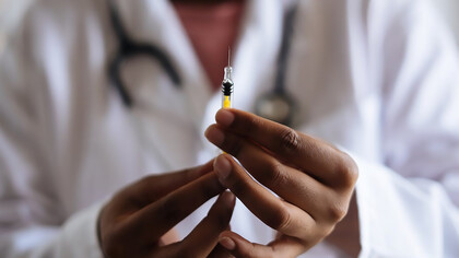 Doctor holding the injection