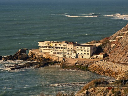 Porto das Barcas, em Portugal. A palavra "Atalaia" deriva do árabe at-talai'a, que significa "torre de vigia" ou "posto de observação". Esta designação sugere que, em tempos antigos, a aldeia poderia ter sido um ponto estratégico de defesa costeira. As atalaias eram comuns em Portugal durante a Idade Média, funcionando como torres de vigilância para detetar possíveis ameaças marítimas, como ataques de piratas ou frotas inimigas