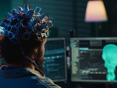 A computer scientist places an EEG headset on a patient, establishing a brain-computer interface that links the brain to cyberspace through neurotechnology