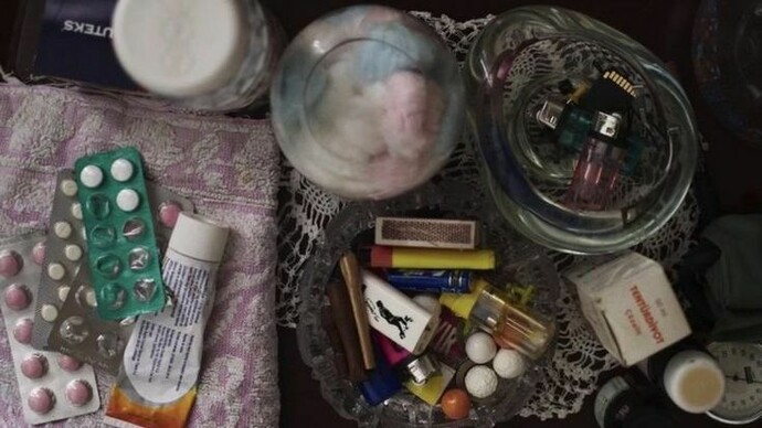 A variety of illicit substances scattered upon a coffee table