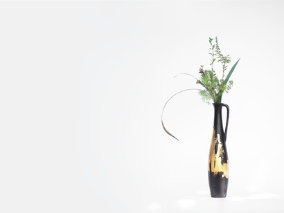 A dark oriental vase, Ikebana is Japanese flower arranging art form
