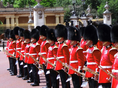 British royal guards marching in rigid symmetry, representing loyalty to institutions struggling to adapt to modern realities