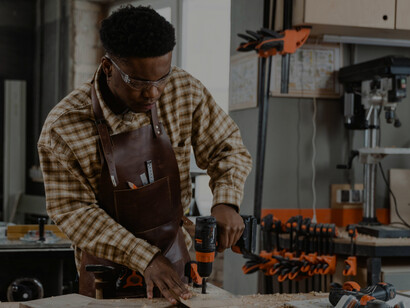 A man inside a carpentry studio, highlighting skilled professional work and an innovative work environment