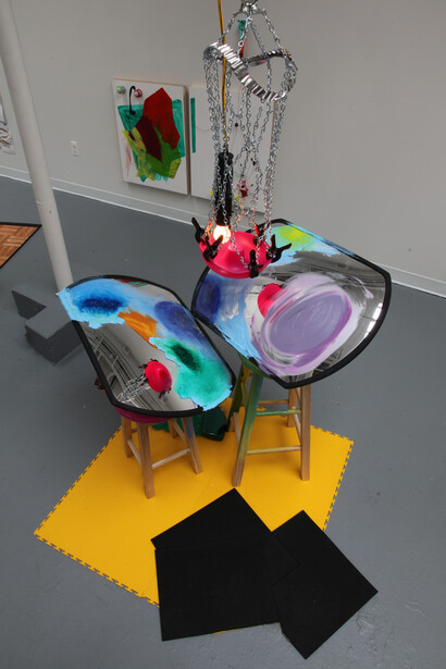 Jessica Stockholder, Gross National Growth, 2014, drive way mirrors, oil paint, acrylic paint, wooden stools, silicone mold, light fixture and cord, clamps, basket ball hoop, pie pan rim, chain and hardware, snap together driveway tiles, black rubber tiles, carpet, plastic parts, copper foil, Hauteur variable (240 cm minimum) x 226 x 160 cm, Courtesy of the artist and Galerie Nathalie Obadia, Paris/Bruxelles