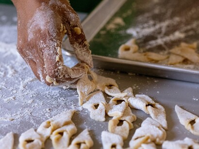 Francisca prepares chin chin, a deep-fried cookie from Cameroon. Courtesy of Ingenium. The Canada Agriculture and Food Museum. Photo by Lisa Milosavljevic 