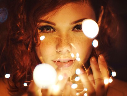 Woman attracting light into her life