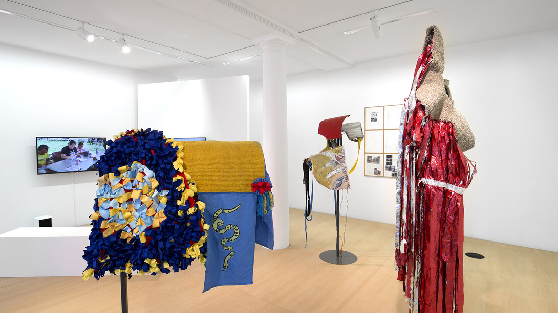 Mohamed Bourouissa, Hustling, 2015, Installation, techniques mixtes / Installation, mixed media, Dimensions variables / Variable dimensions. Costumes des chevaux par Anthony Campuzano et Kate Abercrombie en collaboration avec Mohamed Bourouissa / Horse costumes by Anthony Campuzano and Kate Abercrombie in collaboration with Mohamed Bourouissa. Horse day, 2015, Diptyque. Vidéo / Diptych. Video 13 min 28 sec. Sans titre, 2015, Installation de dessins sur papier / Installation of drawings on paper, 45 x 37 cm, Vue de l’exposition / View of the exhibition « Hustling », kamel mennour, Paris, 2015 © Mohamed Bourouissa. Photo: Julie Joubert, Courtesy the artist and kamel mennour, Paris