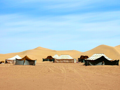 Berber tents in M'hamid El Ghizlane, symbolising the simplicity and resilience of Saharan life