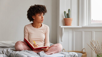 Starting the day with intention, she writes in her journal to clarify her goals and set a positive tone for what lies ahead