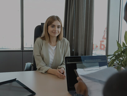 An ambitious woman, fueled by a strong desire to land the job, gracefully maneuvers through the intricacies of the interview process