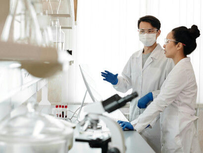 Two scientists working together in a modern research laboratory