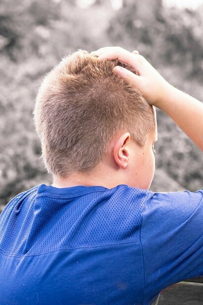 Boy ruminating in shame and sadness