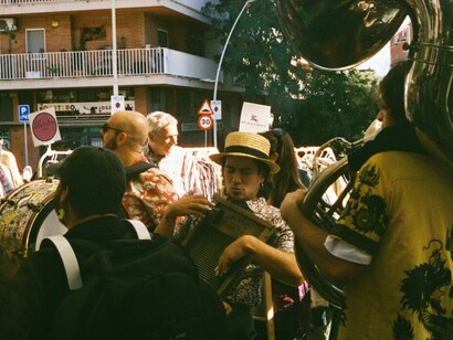 As evening falls over a Spanish street, locals come together with musical instruments, embodying the resilience of their community