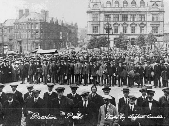 The Preston Pals. Volunteer recruits for a service battalion in civilian clothes, drawn up outside Preston Town Hall during the early months of the First World War, © IWM
