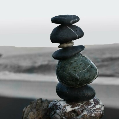 Multiple stones are balanced to create an overall sense of balance