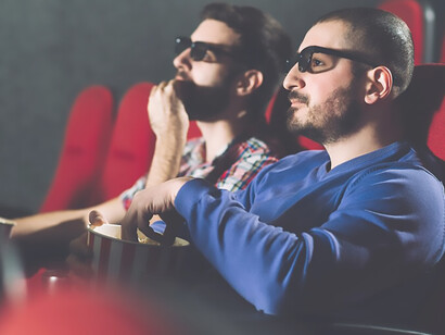 Friends watching film in cinema