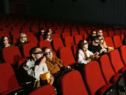 People enjoy watching a film at the cinema