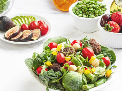 A colorful assortment of fruits and vegetables in a salad, emphasizing the benefits of healthy, plant-based meals for vegan nutrition