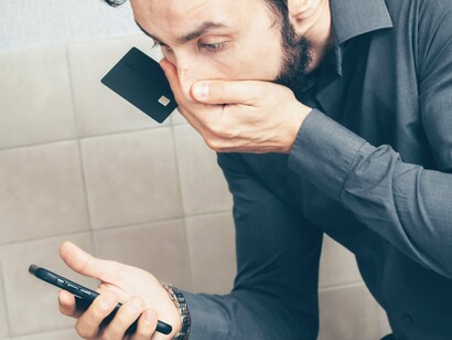 Man on the phone trying with his credit card