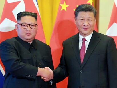 Kim Jong-un and Xi Jinping
