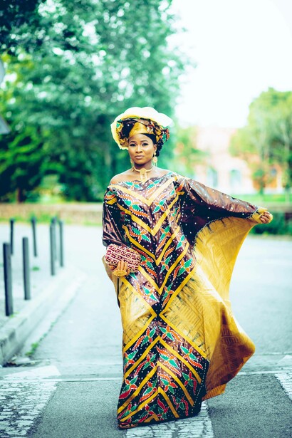 Woman wearing a traditional dress and looking into the camera