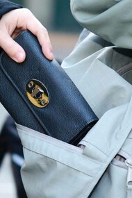 A pickpocketer successfully stole a person's wallet in Paris, France