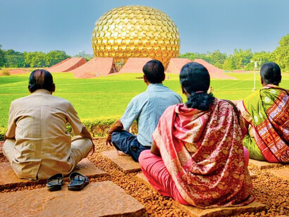 Devotees of Sri Aurobindo outside the Matramandir in Auroville