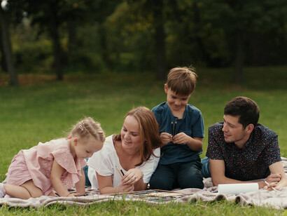A beautiful family enjoys quality time together outdoors, embracing quiet resilience during a power outage