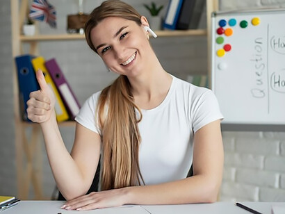 An instructor guiding an online English lesson for learners