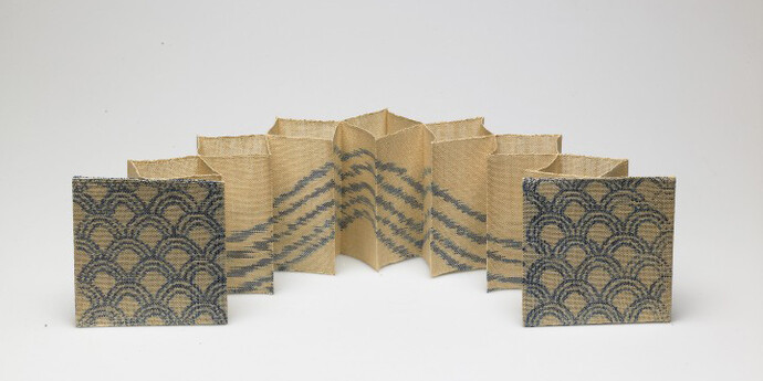 Kay Sekimachi, “Wave”, 1980. Woven book of linen, acrylic paint, and buckram (lining); double weave and warp-painting, 4 3/8 x 4 3/8 x 18 in. Gift of the artist, 2005.124