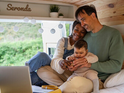 Exploring the world in a campervan, a family enjoys a road trip immersed in nature with their little one