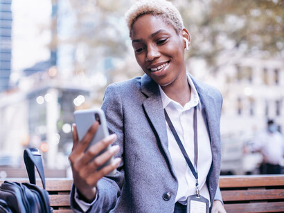 With just a mobile number, a woman facilitates payments, transfers, and withdrawals, bridging the gap between traditional banking and digital finance